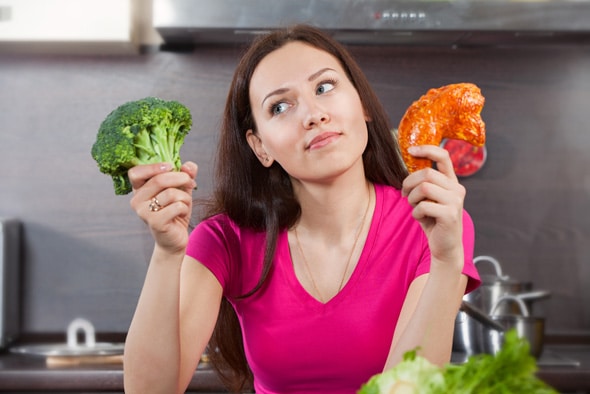 woman-wondering-whether-to-eat-meat-or-vegetables